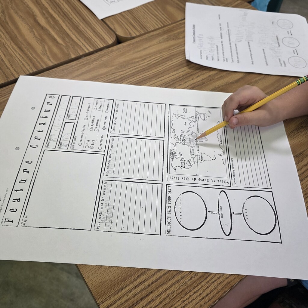 Students in the classroom learning about creatures