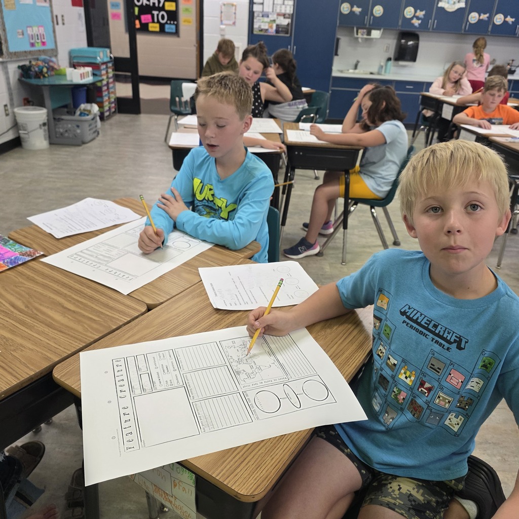 Students in the classroom learning about creatures