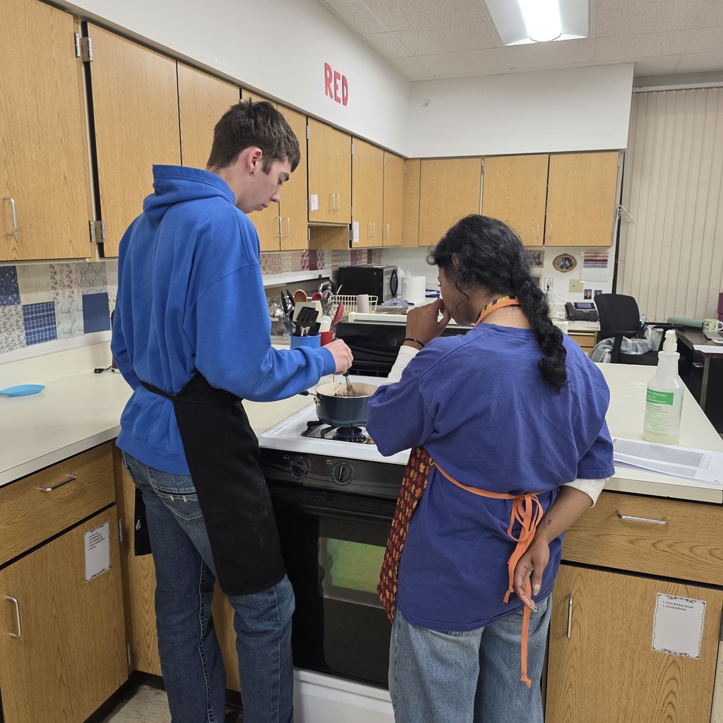 Student cooking brownies in a classroom.