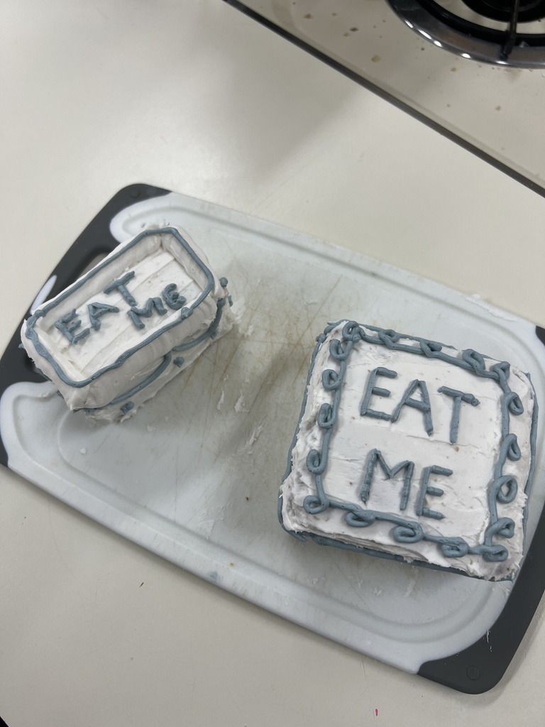 Photos of students with their cakes they made in Foods Class.
