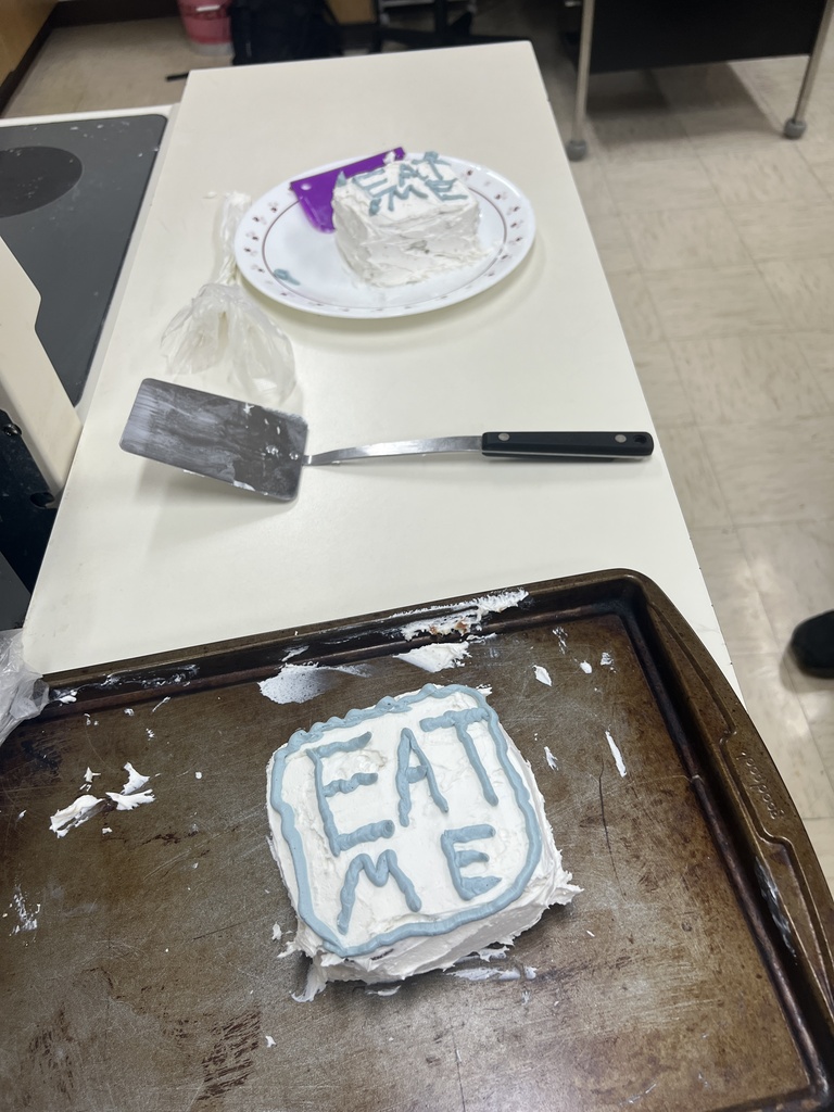 Photos of students with their cakes they made in Foods Class. 