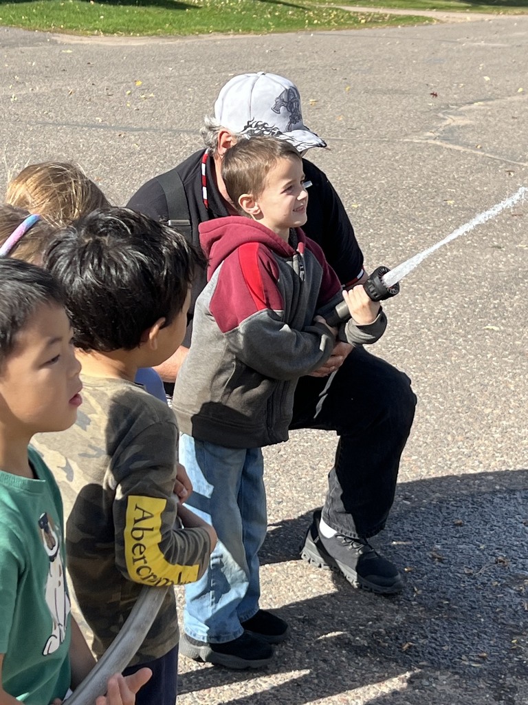 Fire Safety Week Photos showing students learning about fire safety
