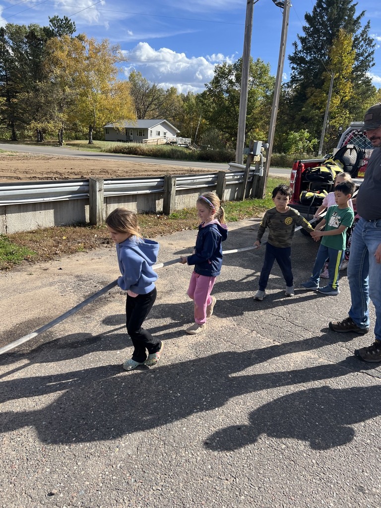 Fire Safety Week Photos showing students learning about fire safety