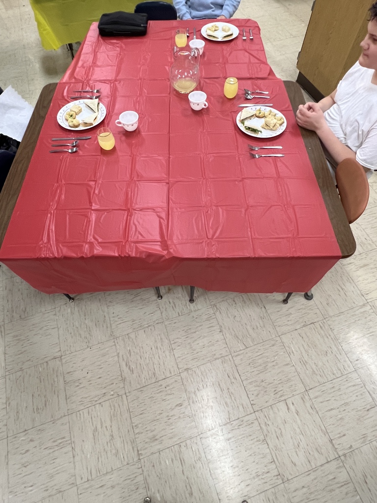Students learning about table manners