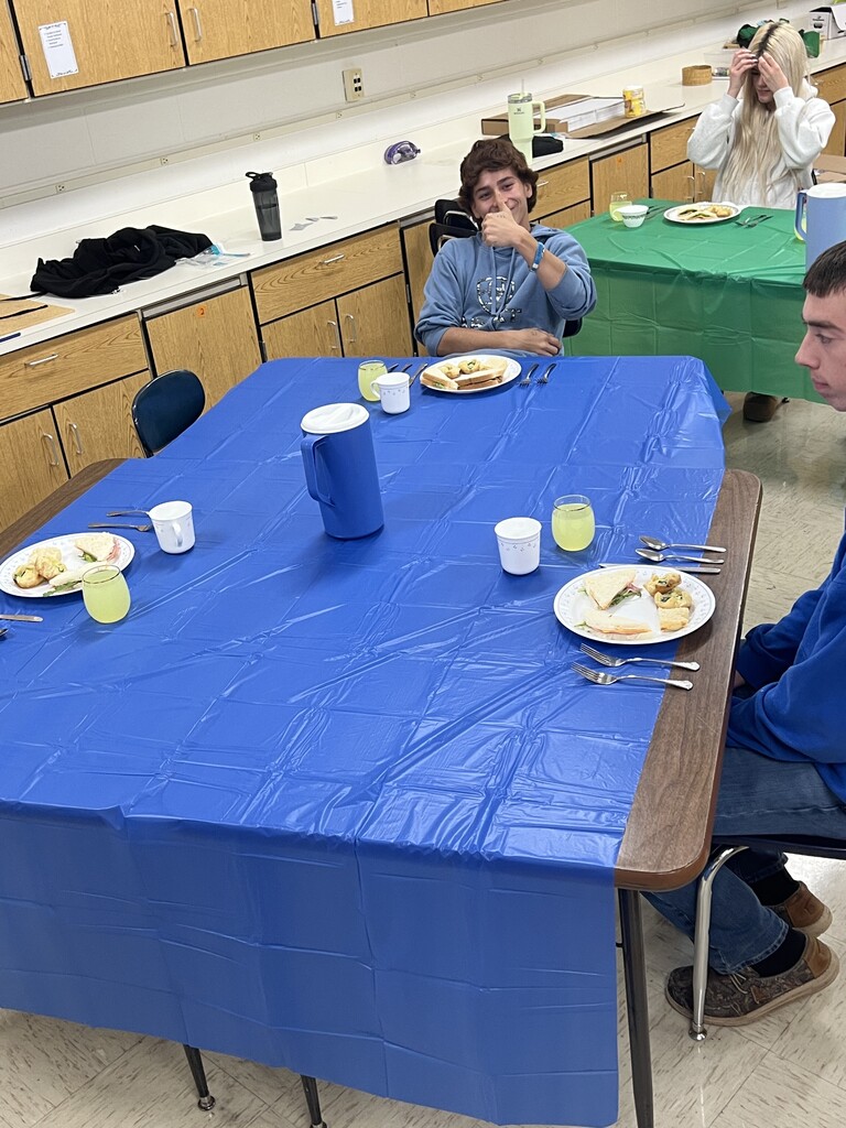 Students learning about table manners