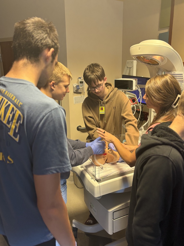Student working on a pretend baby at a Career fair
