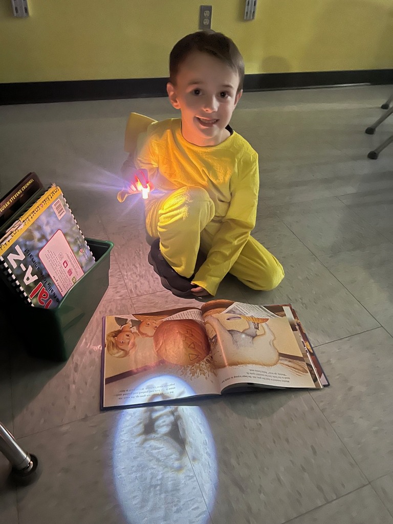 Children reading with finger lights