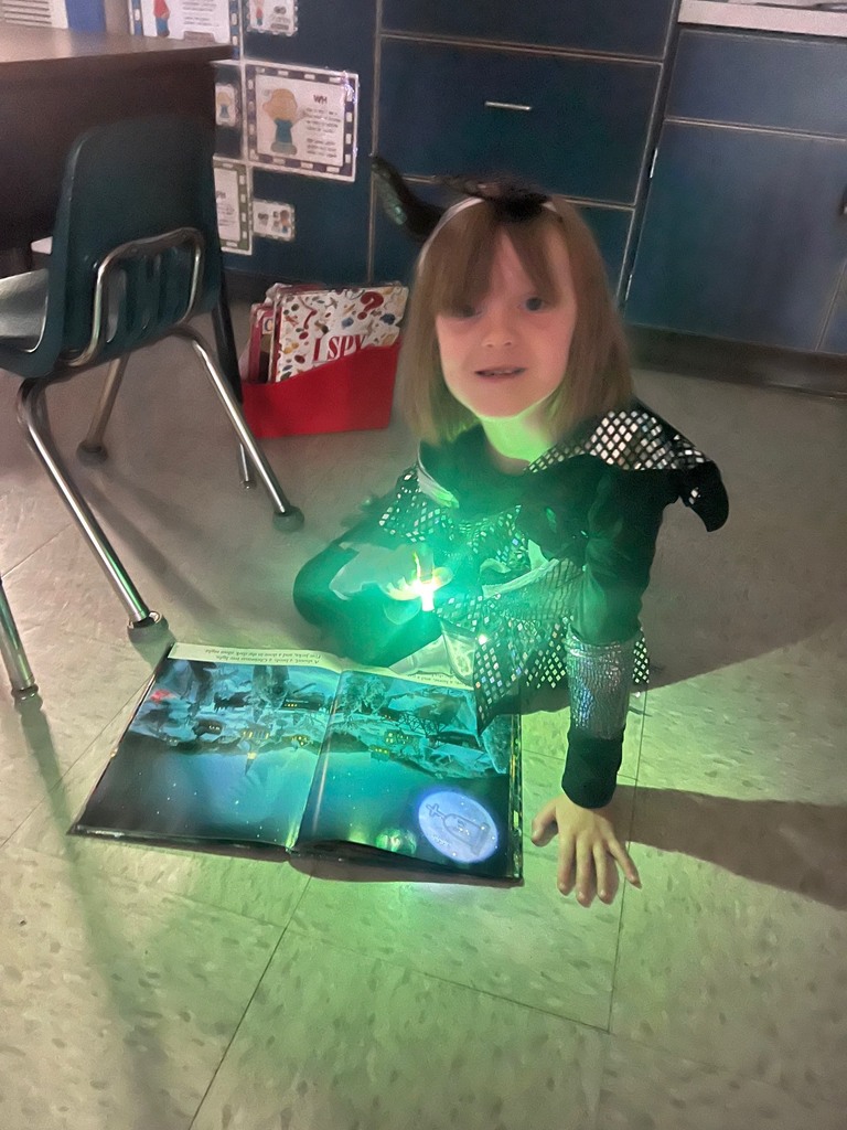 Children reading with finger lights