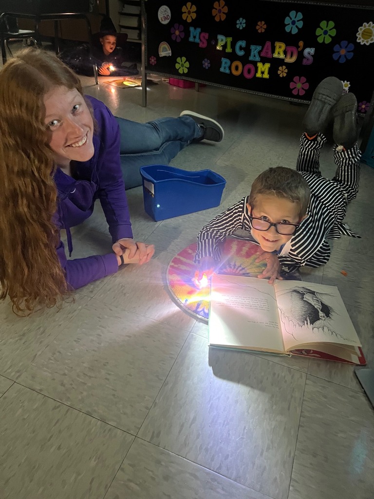Children reading with finger lights