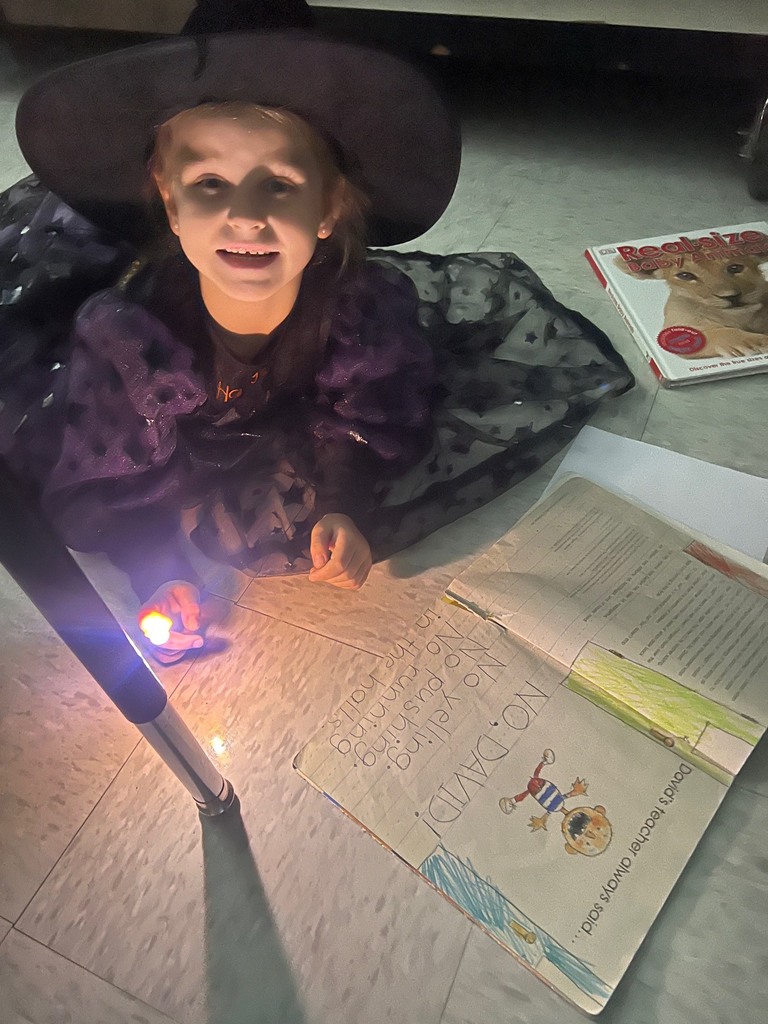 Children reading with finger lights