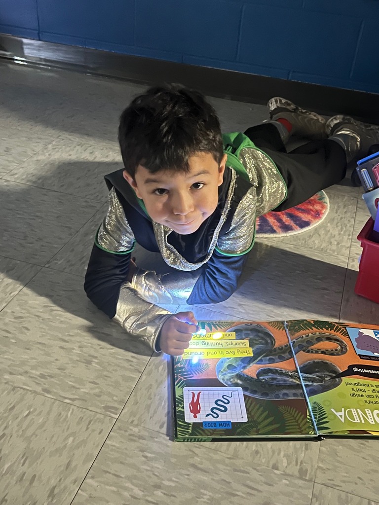 Children reading with finger lights