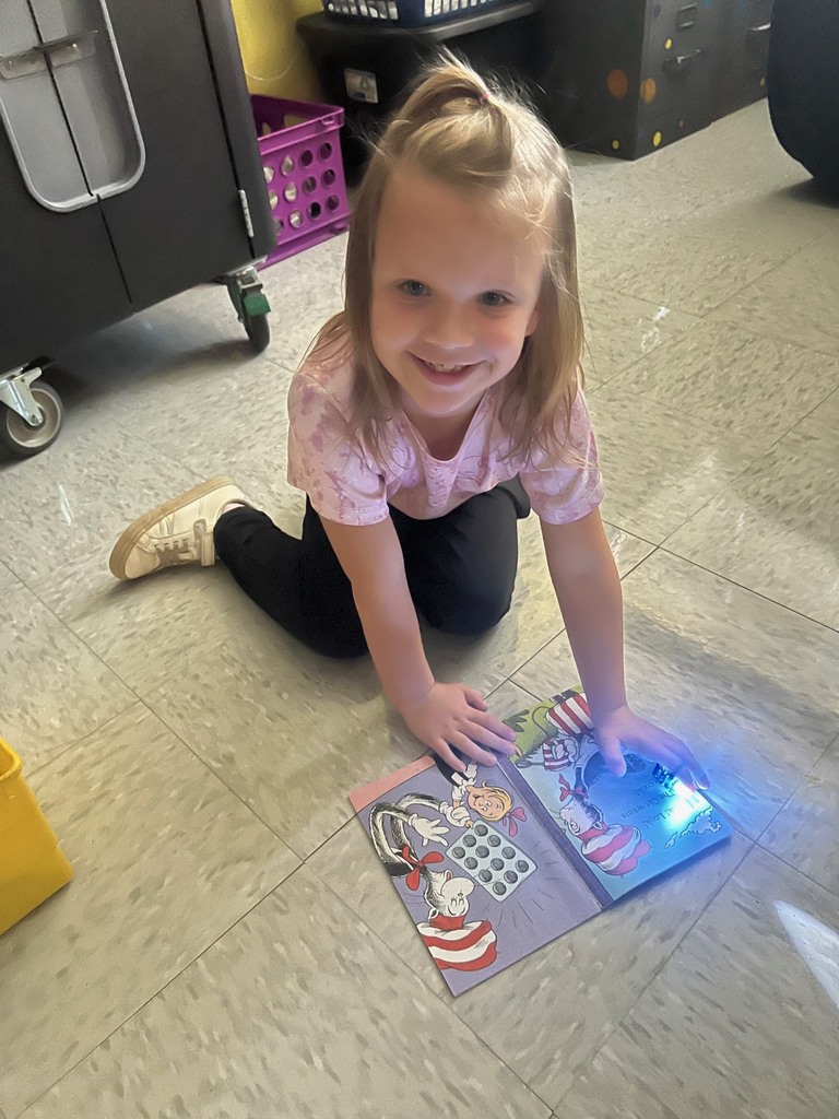 Children reading with finger lights