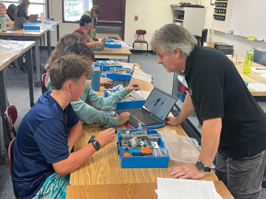 7th graders having a great time learning in the Intro to Robotics class taught by Mr. Aldrich