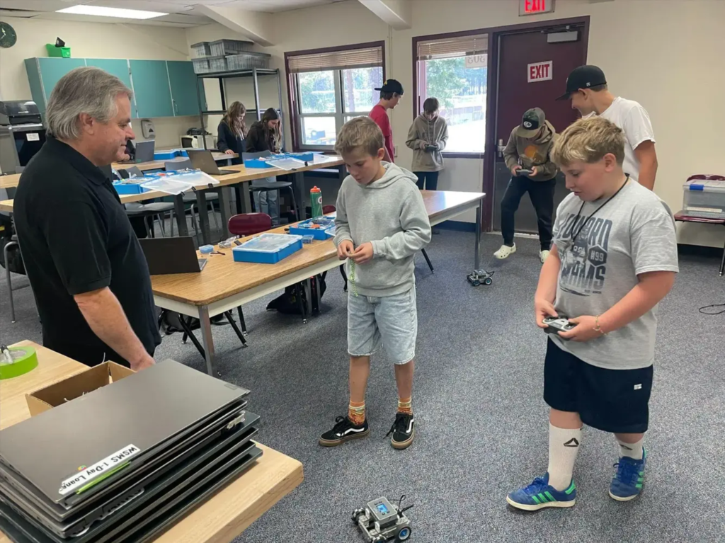 7th graders having a great time learning in the Intro to Robotics class taught by Mr. Aldrich