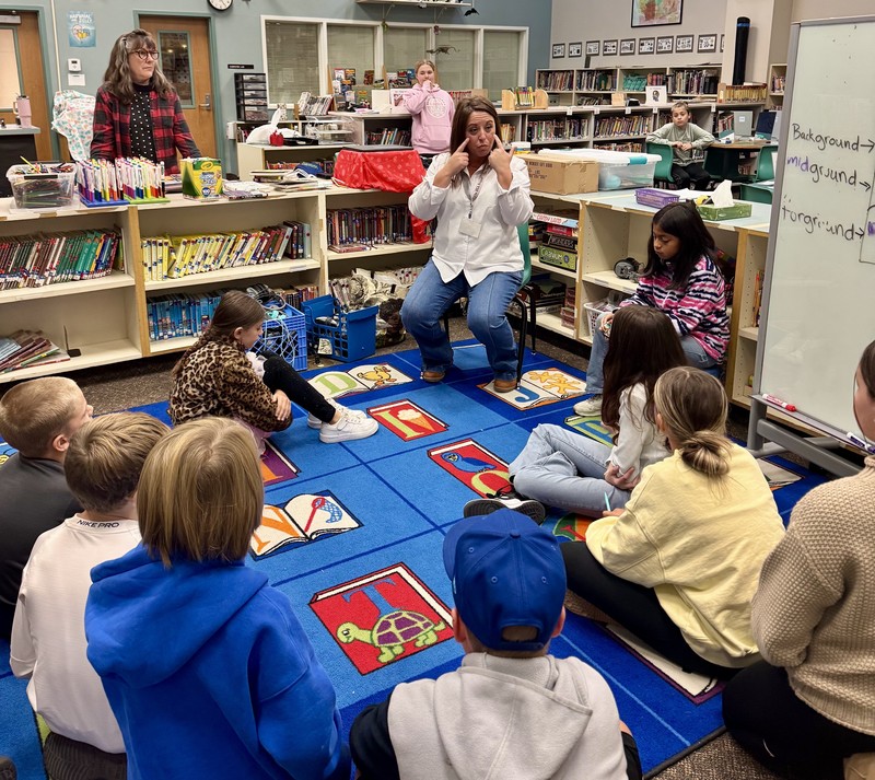 students listening to a teacher