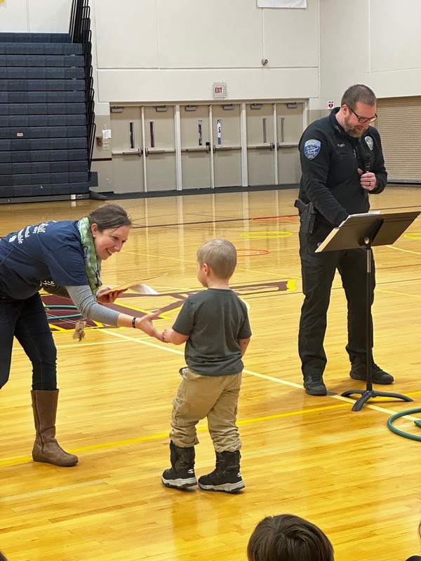 passing out an award to a student
