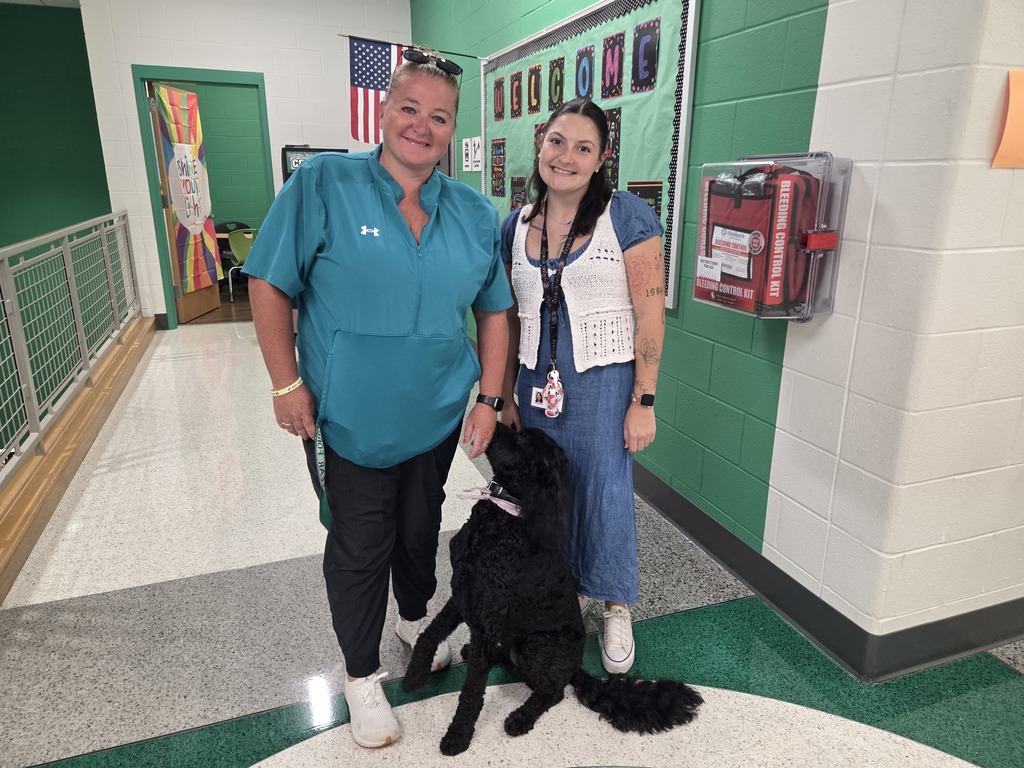 Kallee, Ms. Brokaw and Ms. Barry greet students at Bellville
