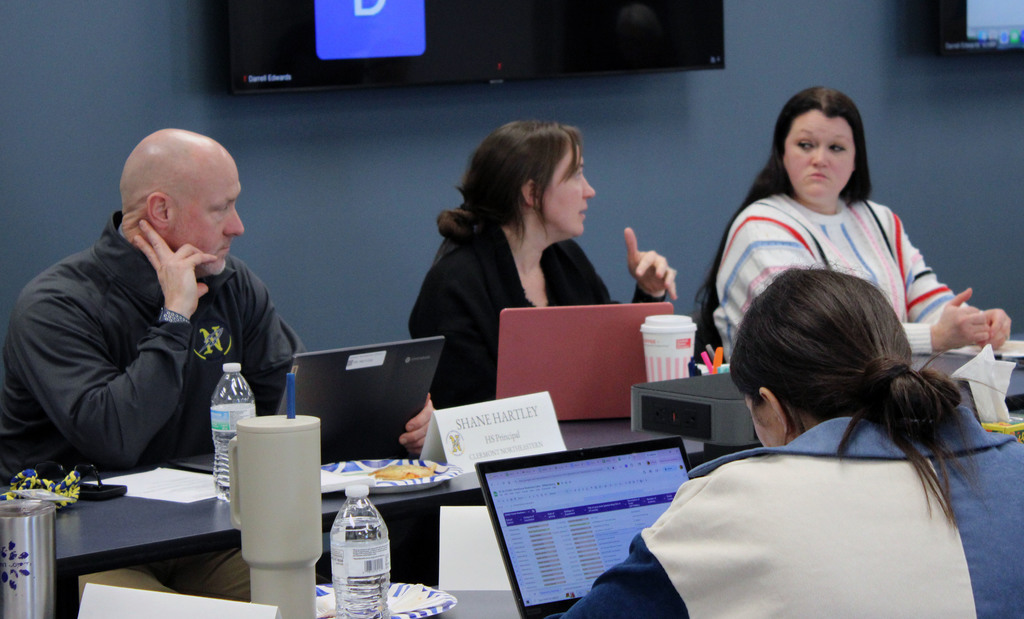 Work-Based Learning team members actively engage in a conversation.