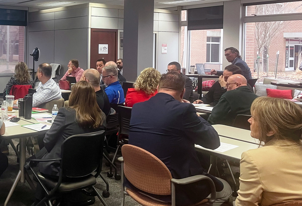 Attendees of the Clermont County Superintendent meeting absorbing information and listening to presentations.