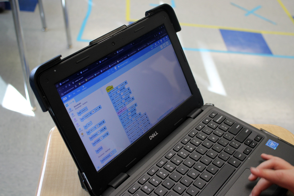 Student uploading code to their VEX robot so they could do a different course with their robot.