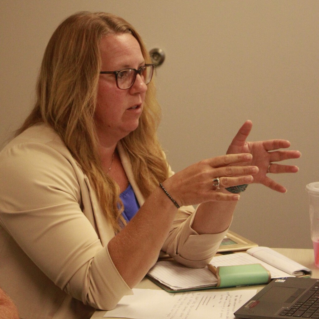 Woman talking during the Student Success Team meeting.