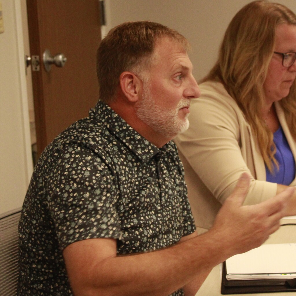 Man talking during the Student Success Team meeting.