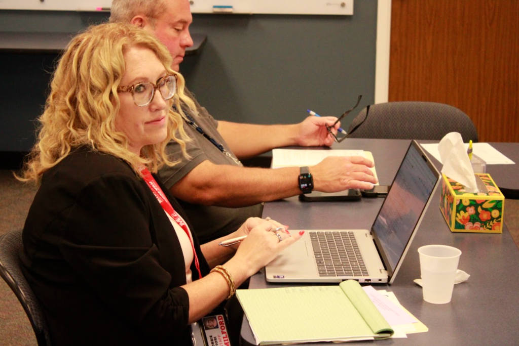 Milford Exempted Village School District Superintendent Dr. Bobbie Fiori looks over at Great Oaks Career Campuses President/CEO Harry Snyder (Not Pictured) during the 8/27/26 Superintendents meeting.