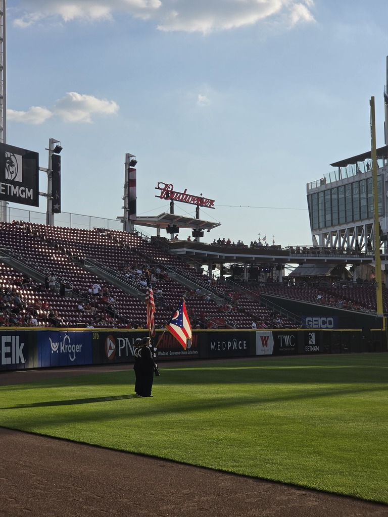 CNE Color Guard presenting the flags with Cincinnati Reds fan in the background.
