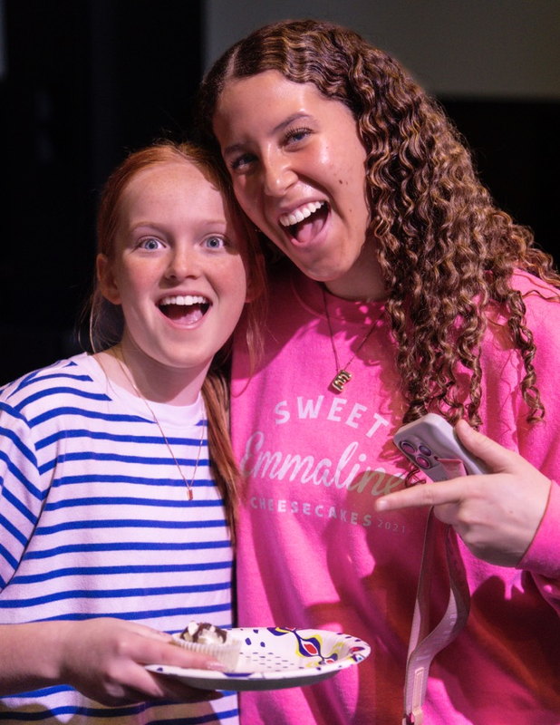 Emily Patterson & 7th grader Finley Mahoney pose with cheesecake