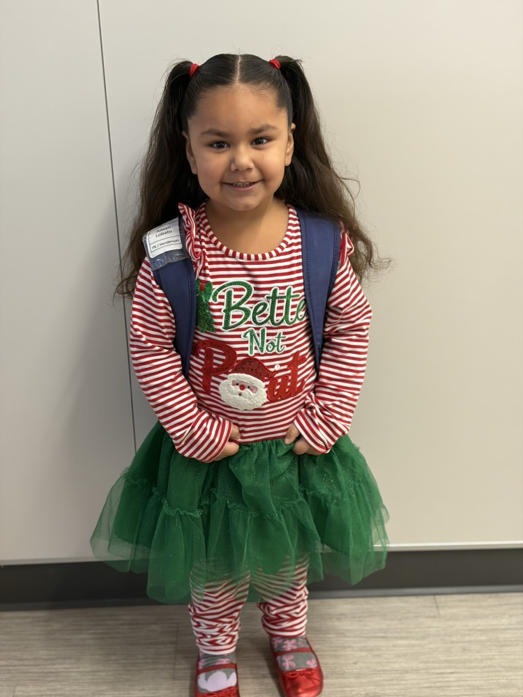 Child dressed as a Candy Cane