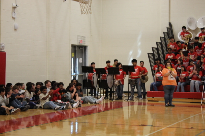 Orange, Black, Red color flyer with District Logo;  along with sports teams  and  organizations Photos!