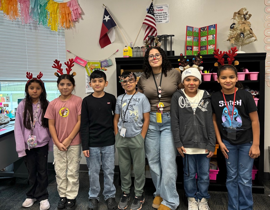 Children and teacher dressed as Christmas Reindeer