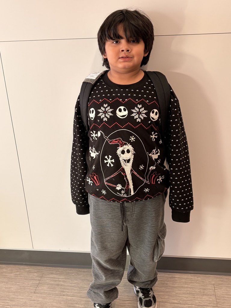 Child wearing Christmas Ugly sweaters