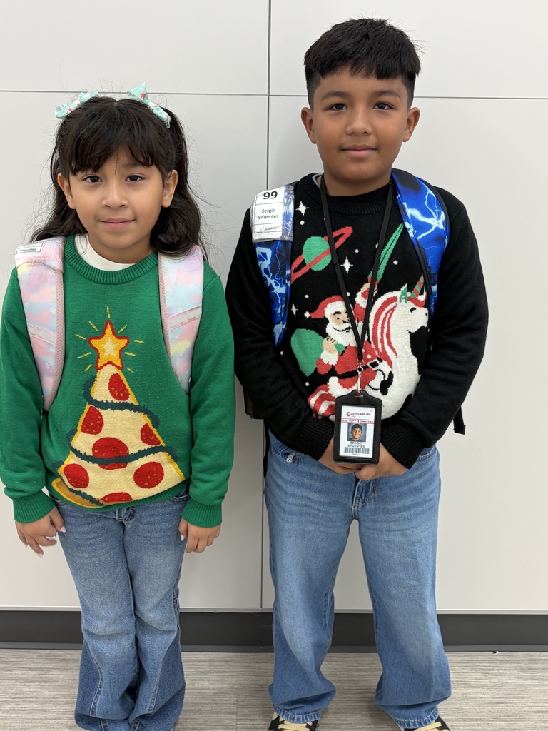 Children wearing Christmas Ugly sweaters