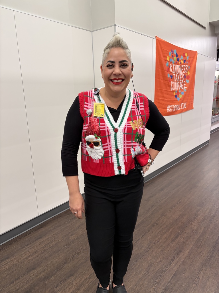 Principal wearing Christmas Ugly sweaters