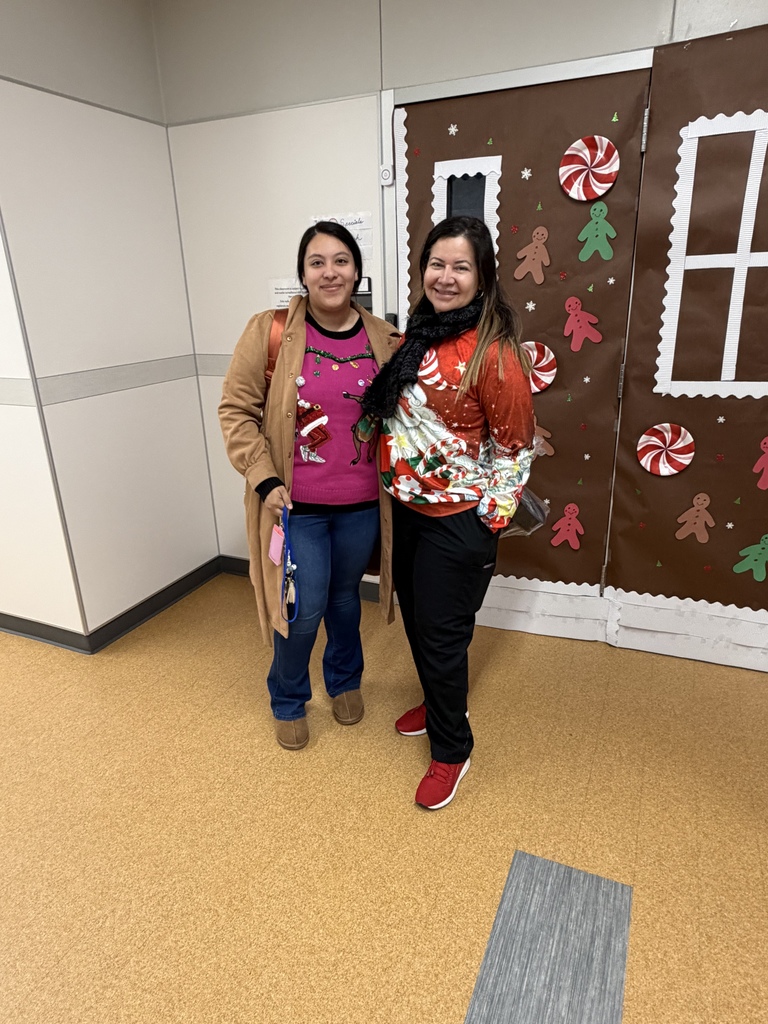 Teachers wearing ugly christmas sweaters