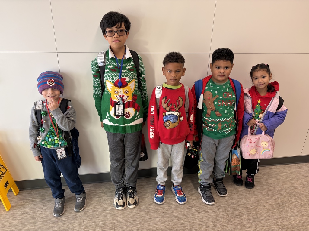 Group of Elementary Students wearing ugly Christmas dresses