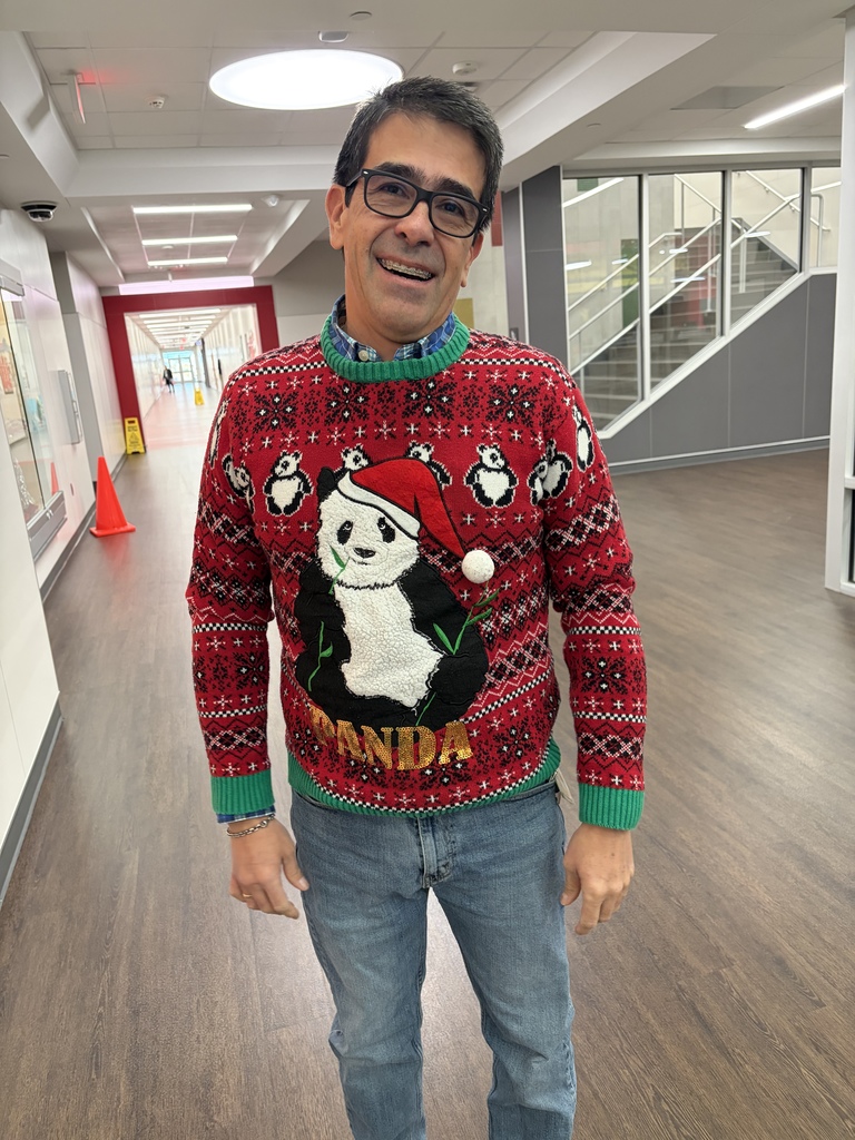 Teacher wearing Christmas Ugly sweaters
