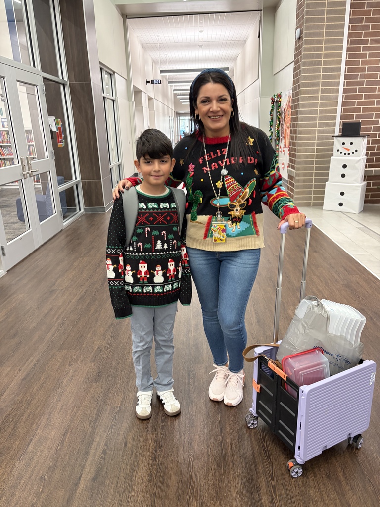 Children wearing Christmas Ugly sweaters