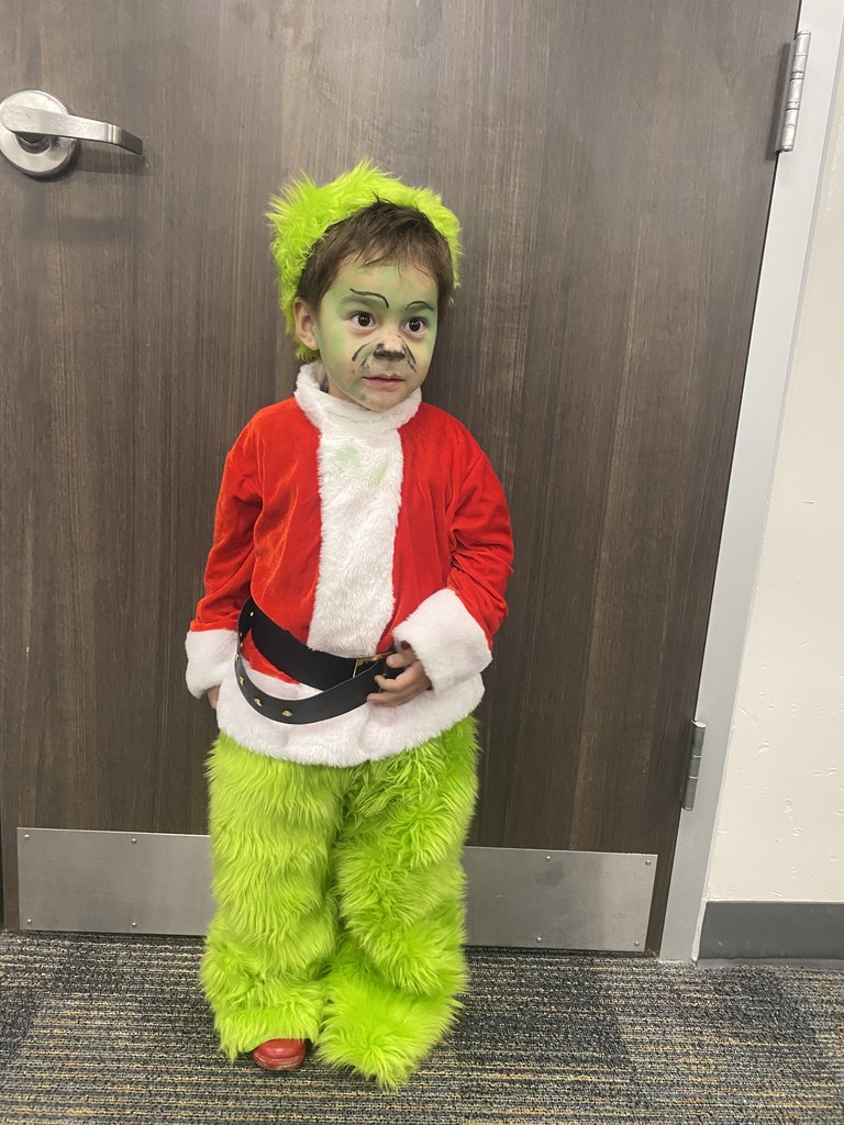 Child dressed as the Grinch