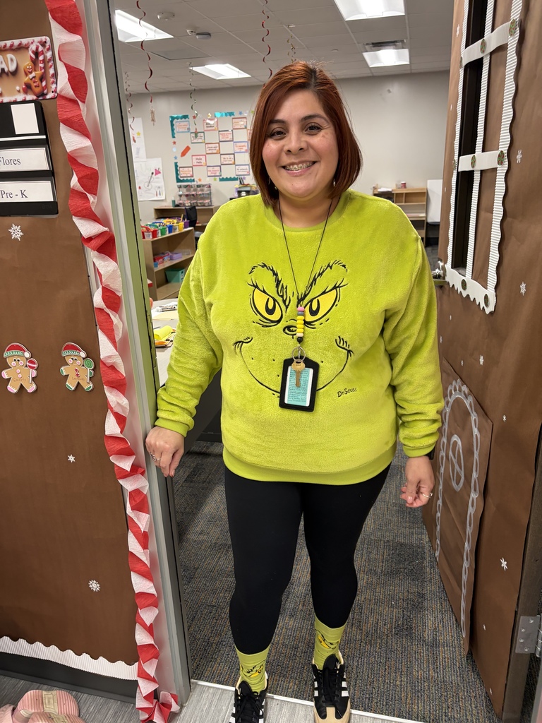 Teacher dressed as the Grinch