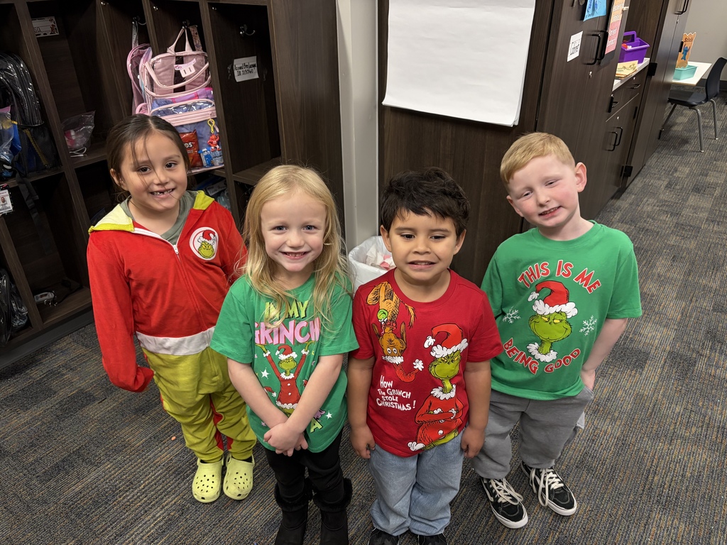 Group of small children dressed as the Grinch