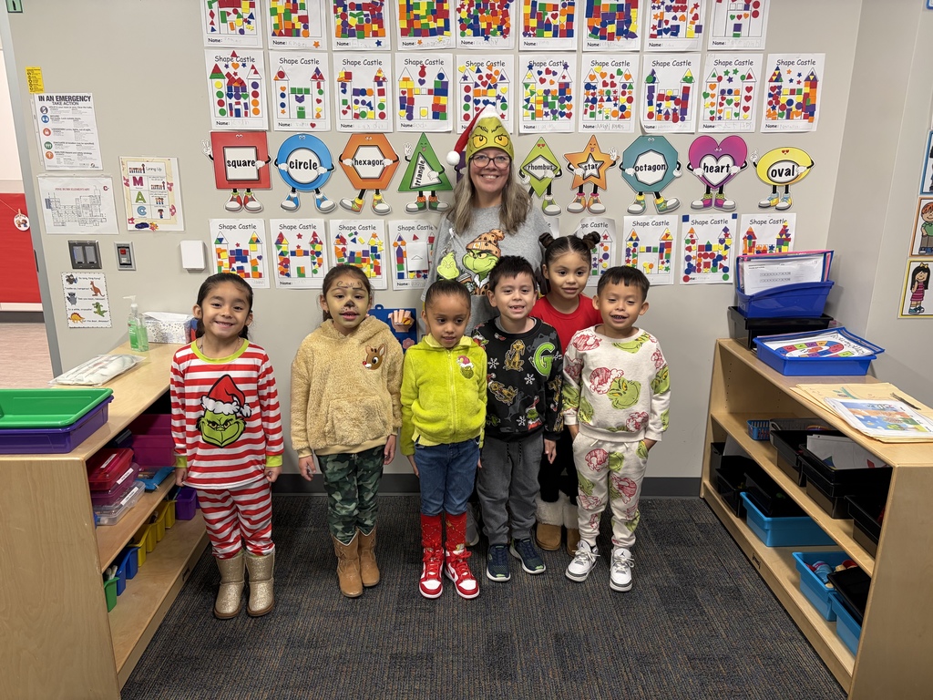 Group of small children dressed as the Grinch