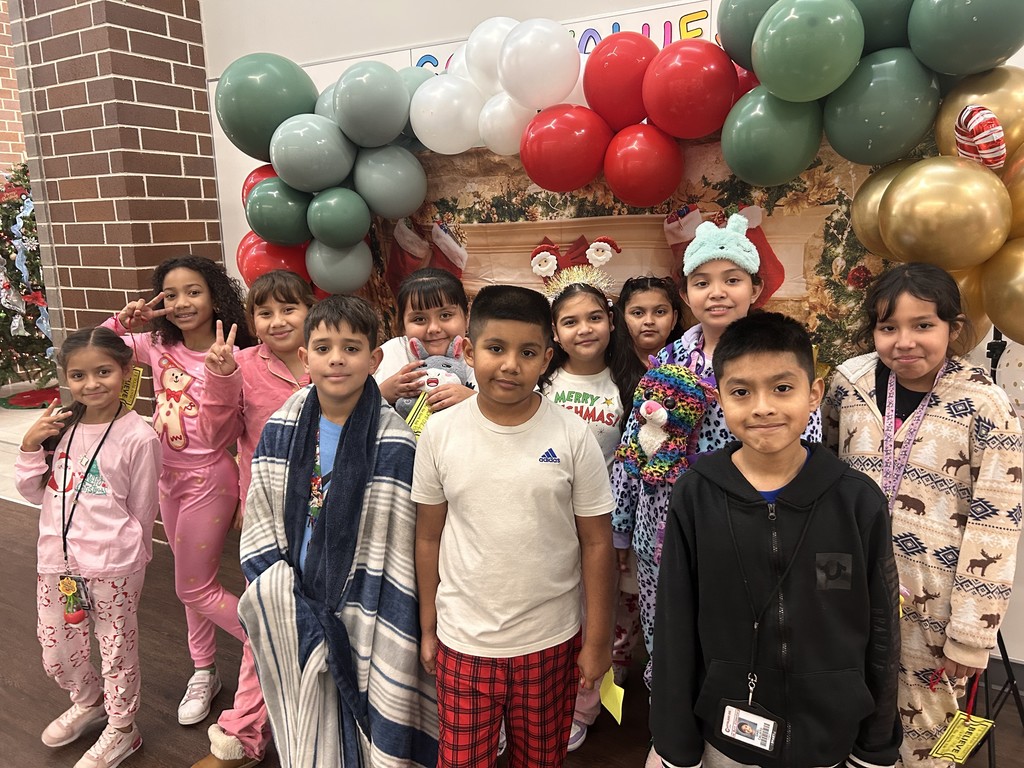 Children wearing Christmas pajamas