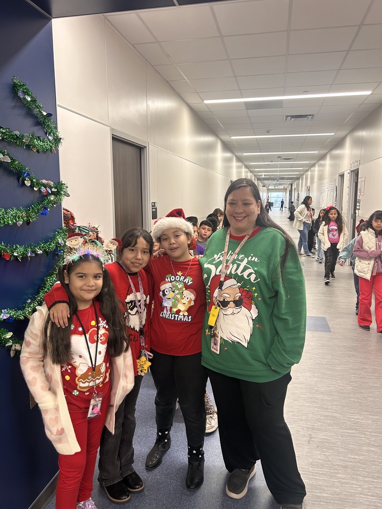 Teacher and students wearing ugly sweaters