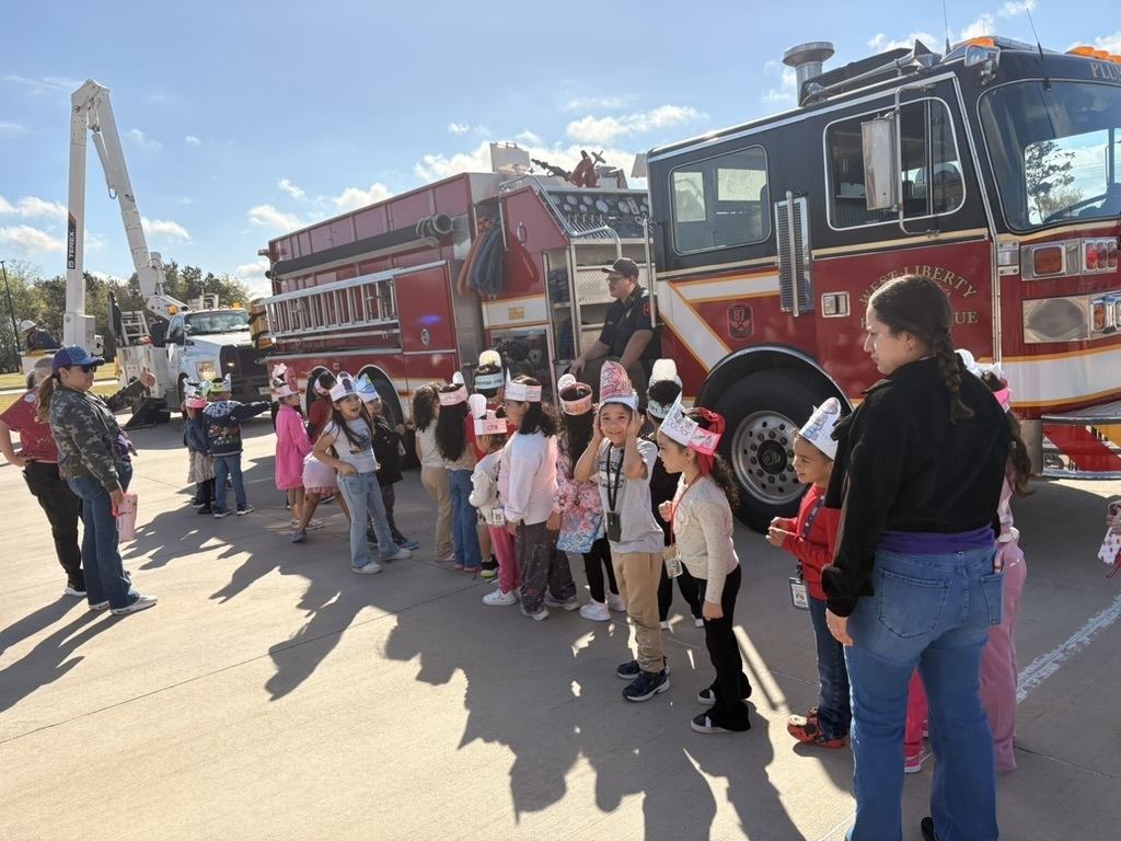 Children watching a fire truck