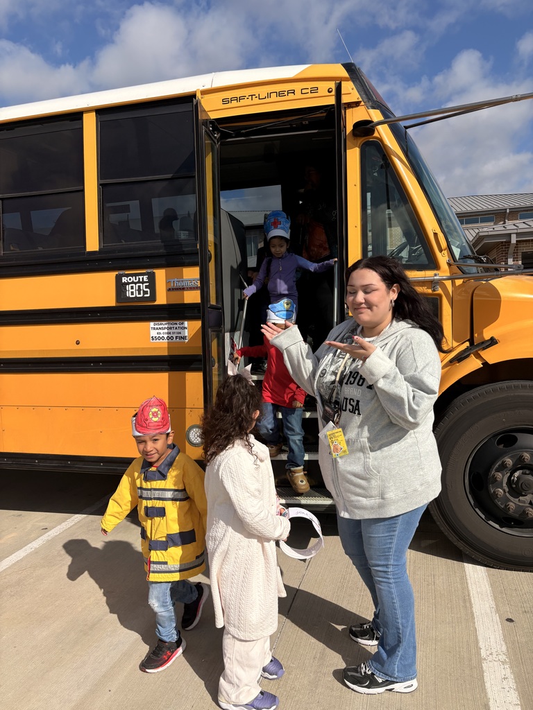 students and teacher hoping on a school bus