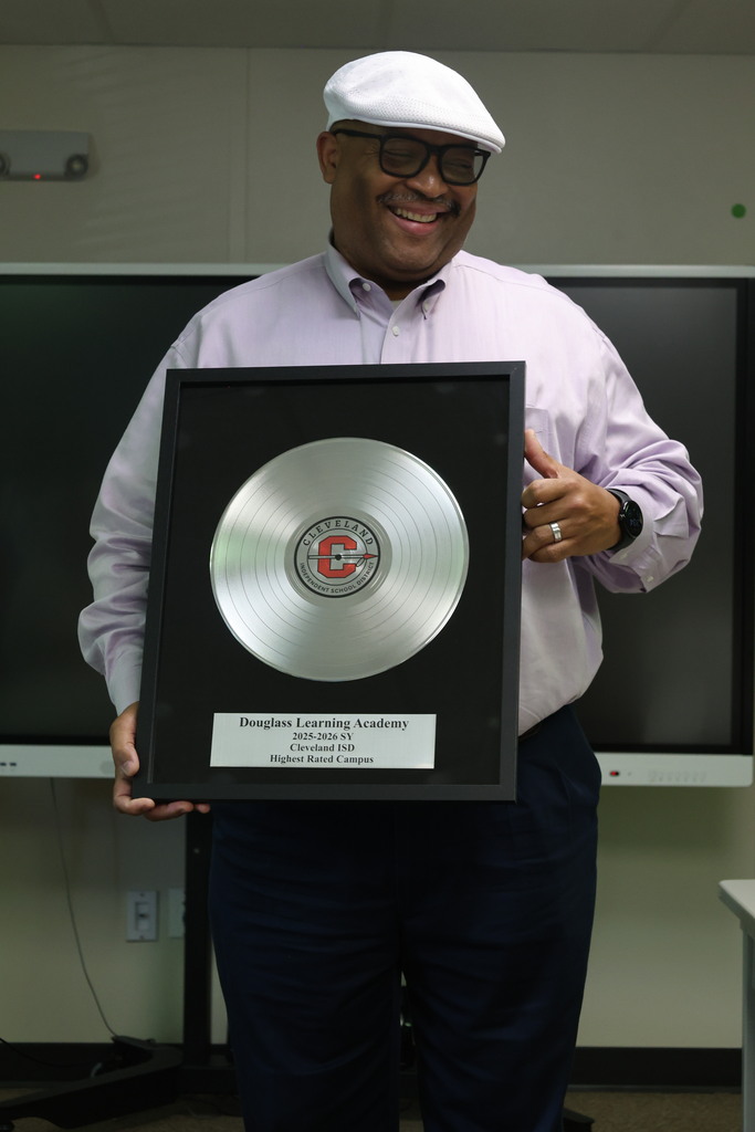 Dr. Glenn Barnes presented the Highest Scoring Campus for Cleveland ISD award