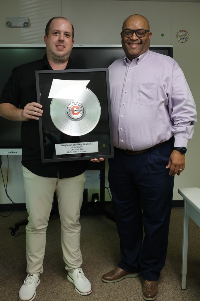 Principal Travis Agnew received the Highest Scoring Campus award from Superintendent Dr. Glenn Barnes