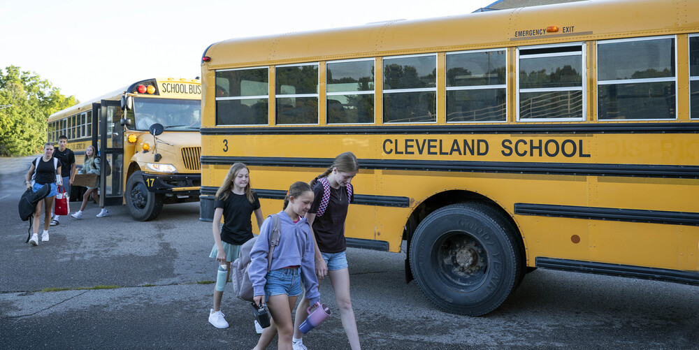 Students by buses